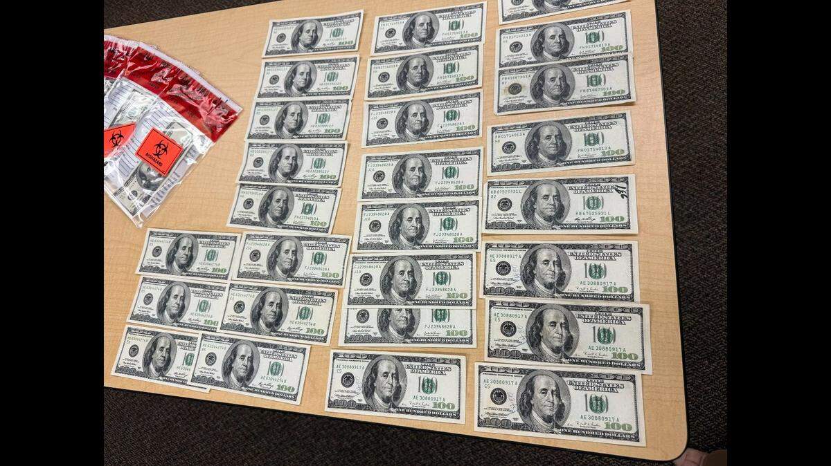 Investigators say the fake $100 bills were manufactured from real $10 bills that had been altered.