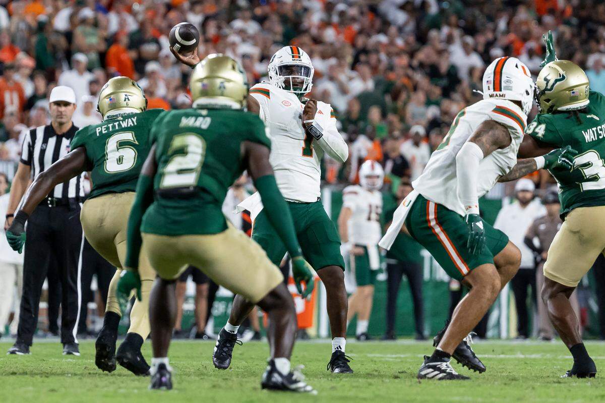 Miami Hurricanes quarterback Cam Ward (1) throws the ball in the second half of his NCAA college football game against the South Florida Bulls at the Raymond James Stadium on Saturday, Sept. 21, 2024, in Tampa, Fla.