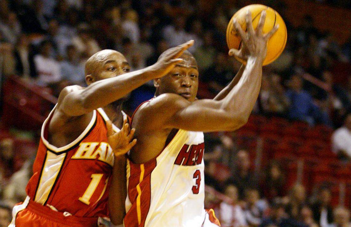 The Heat’s Dwyane Wade drives on the Hawks’ Jacque Vaughn during Miami’s 97-79 win at AmericanAirlines Arena on Dec. 16, 2003. Wade led with 32 points.