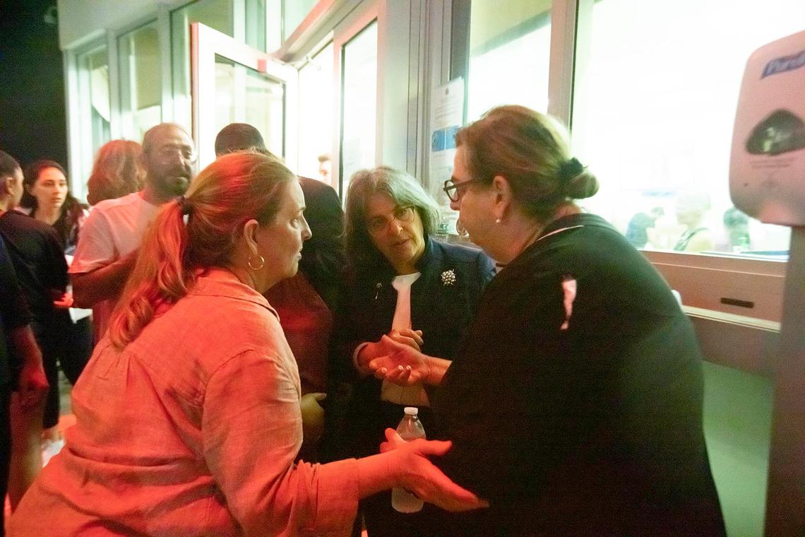Daniella Levine Cava, Mayor of Miami-Dade County, talks to family and friends of victims during the search-and-rescue operation after the partial collapse of the Champlain Towers South in Surfside on Thursday June 24th., 2021.