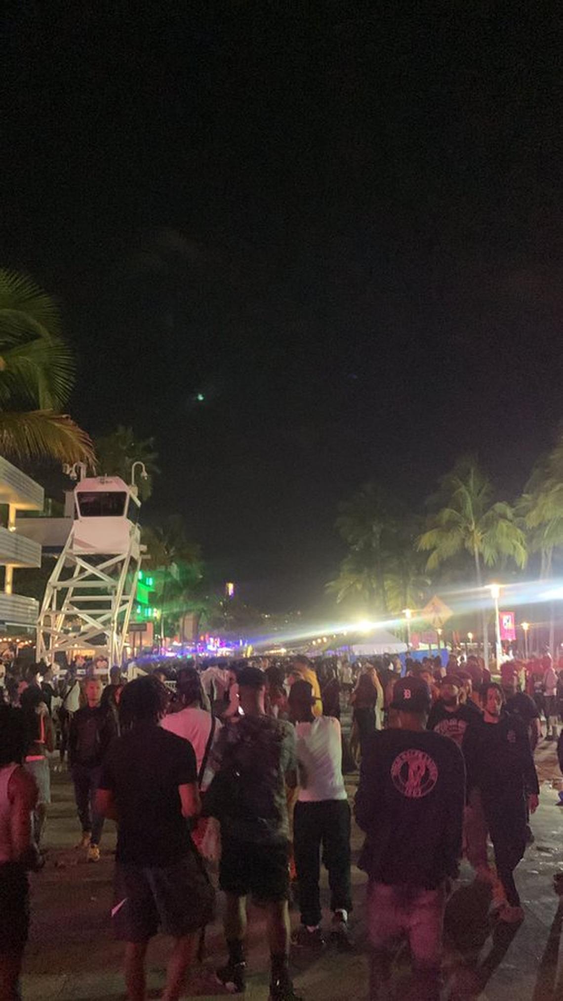 Crowds mill about on Ocean Drive on Friday night, March 17, 2023.