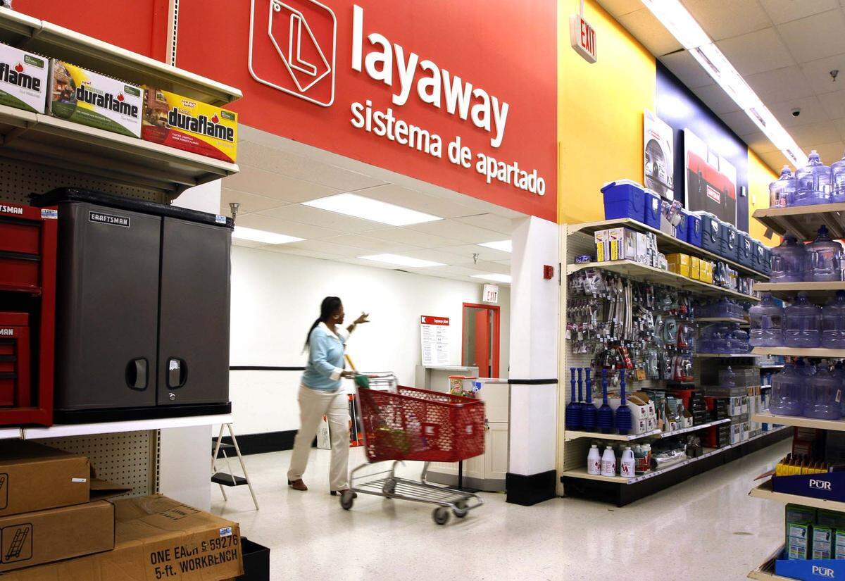 In this file photo from 2008, a customer drops some items off at the layaway department at the Kmart in Hollywood,