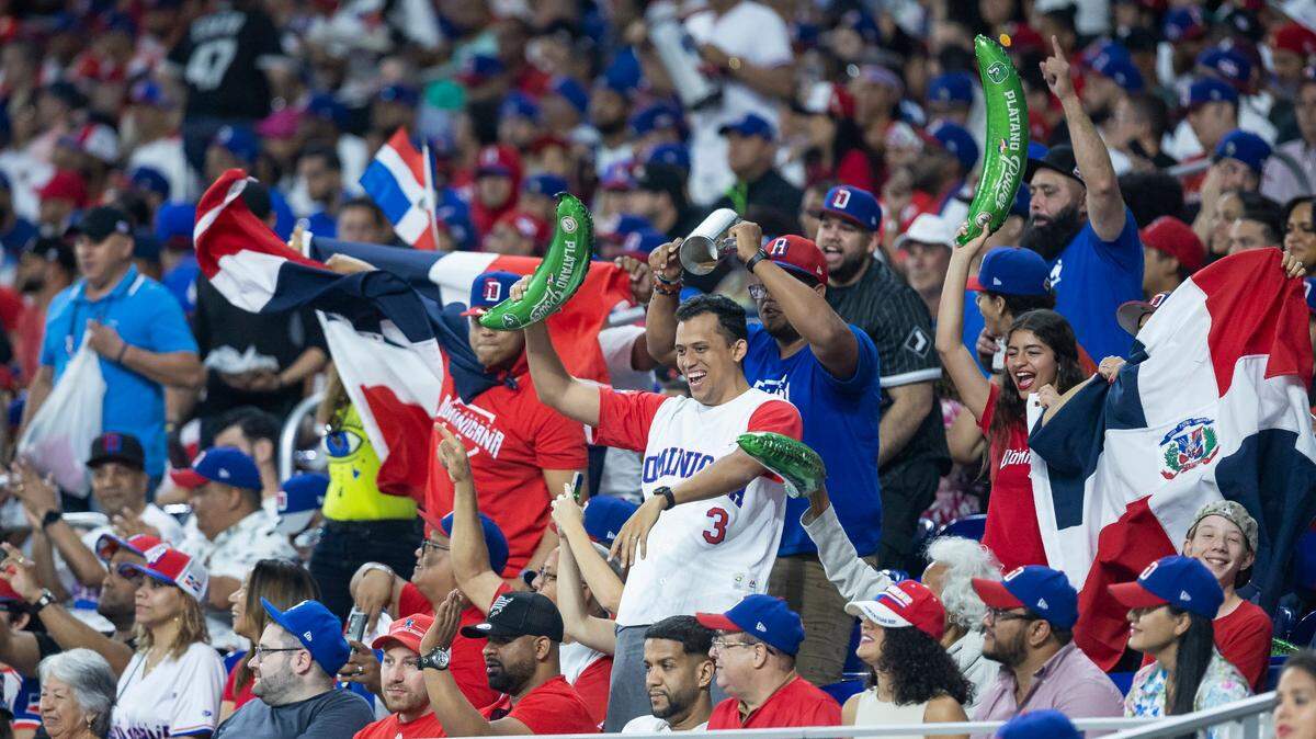 Dominican Republic fans cheer for their team during the second inning of a Pool D game against Israel at the World Baseball Classic at loanDepot Park on Tuesday, March 14, 2023, in Miami, Fla.