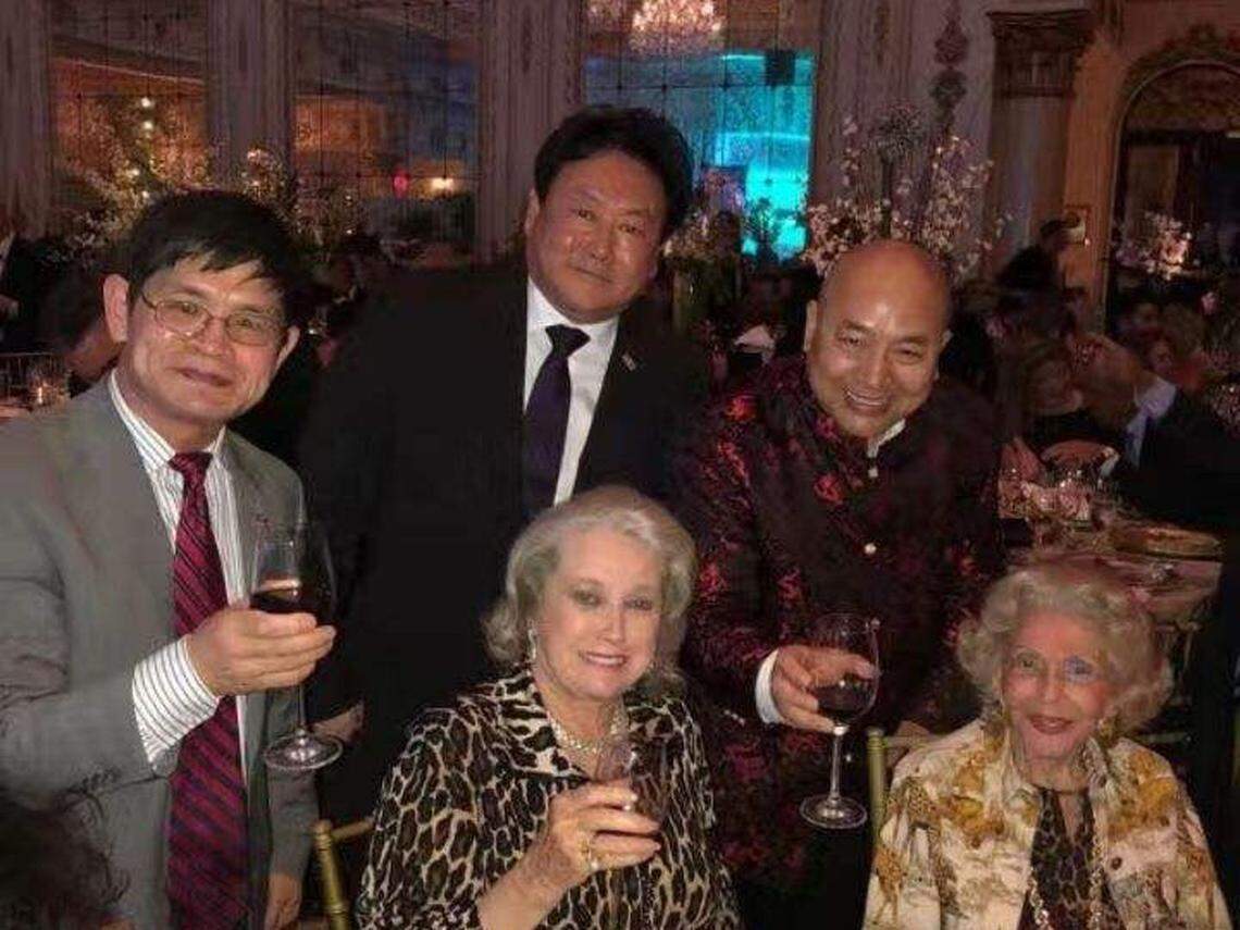 At a ‘Safari Night’ fundraiser at Mar-a-Lago in 2018, Daniel Lou (left) and his NY-based associate Jimmy Chue (center back), pose with Elizabeth Trump Grau (center front) and Cindy Yang’s associate Charles Lee (back right).