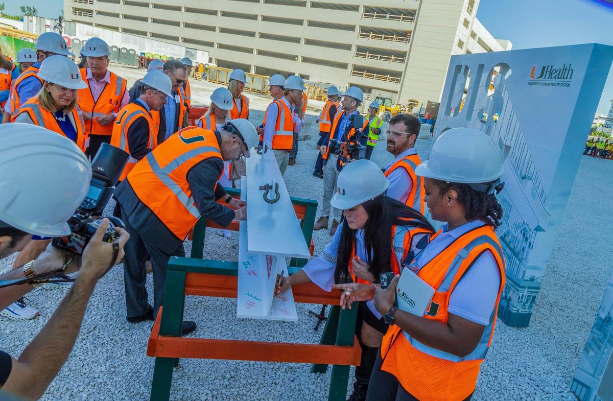 Guests including UHealth executives, representatives from LeFrak and Turnberry development companies and representatives form Robins & Morton Construction Firm, signed a metal beam during the topping off ceremony at the construction site where the new UHealth at SoLé Mia medical facility, is been built in North Miami. The seven-story, 363,000-square-foot medical center will include cancer specialists from Sylvester Comprehensive Cancer Center, advanced vision care from the No. 1 ranked eye hospital in the country, Bascom Palmer Eye Institute; urological treatments from the Desai Sethi Urology Institute, on Friday April 05, 2024.