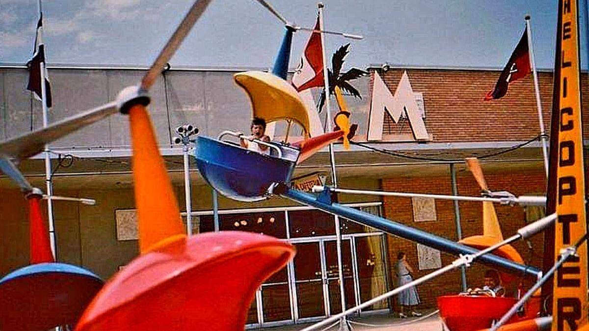 The Kiddie Park at the 163rd Street Shopping Center had an amusement park, like these helicopter rides, when the North Miami-Dade mall opened in November 1956. By 1980, construction began to enclose the mall and the outdoor amusement had been confined to history pages. The center was also renamed The Mall at 163rd Street.