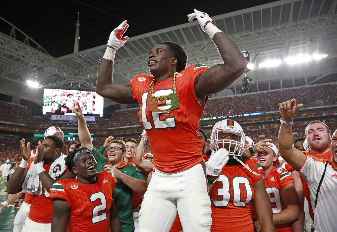 Miami Hurricanes defensive back Malek Young (12) wears the turnover chain after intercepting a pass in the second quarter against  Notre Dame at Hard Rock Stadium on Saturday, November 11, 2017.