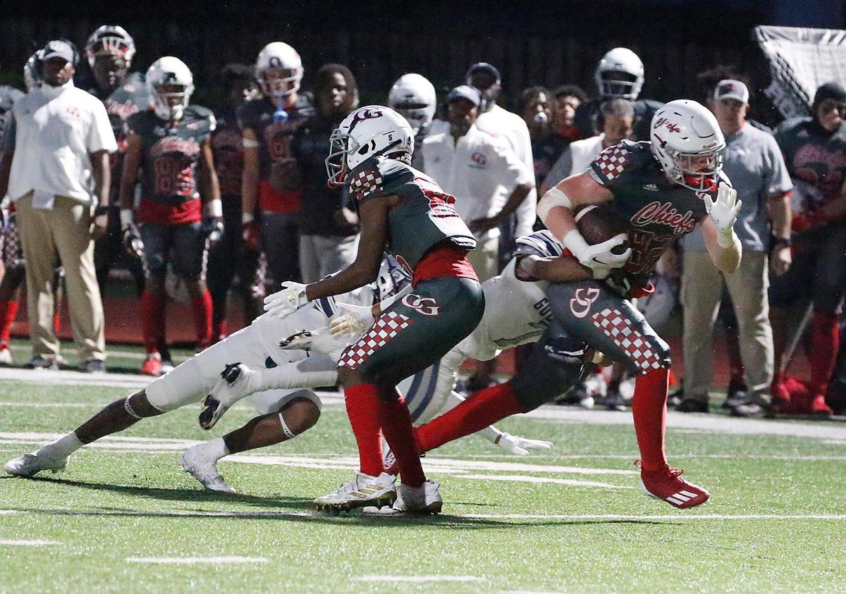 Cardinal Gibbons Chiefs Colton Heinrich (82) tries to break free during football game against Gulliver Raiders on Friday, September 9, 2022 at Cardinal Gibbons HS in Fort Lauderdale. Andrew Uloza / for Miami Herald