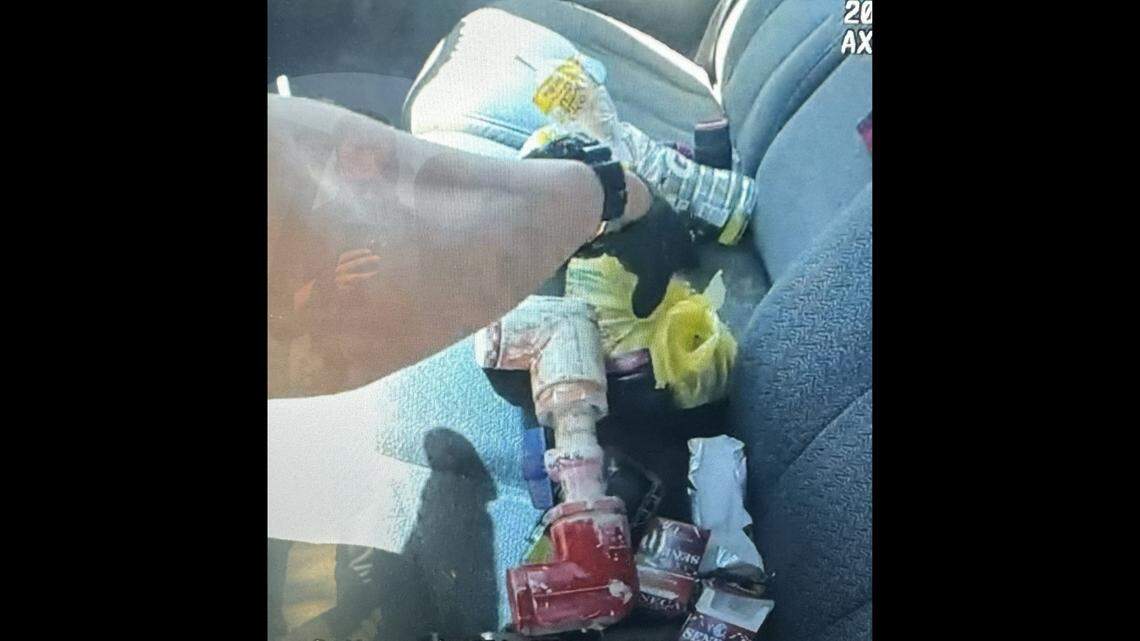 A device in the white pipe exploded as the deputy was searching the vehicle, officials said.