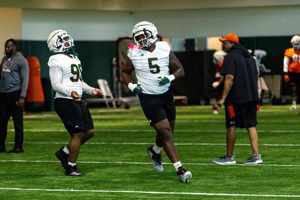 Miami Hurricanes defensive lineman Justin Scott (5) runs through drills during spring practice at the Carol Soffer Indoor Practice Facility at the University of Miami on Wednesday, March 5, 2025, in Coral Gables, Florida. 