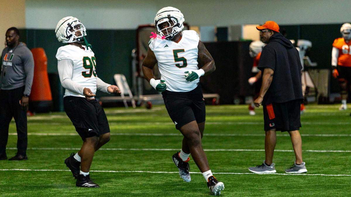 Miami Hurricanes defensive lineman Justin Scott (5) runs through drills during spring practice at the Carol Soffer Indoor Practice Facility at the University of Miami on Wednesday, March 5, 2025, in Coral Gables, Florida. 