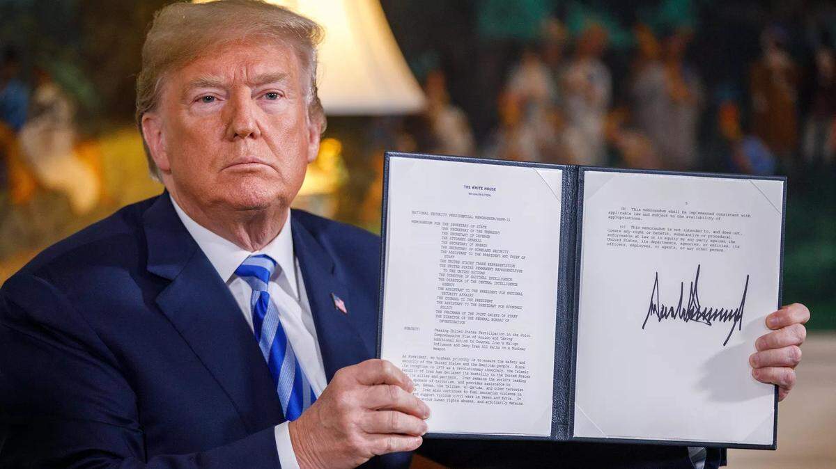 In 2018, President Trump displays a presidential memorandum on the U.S. withdrawal from the Iran deal.