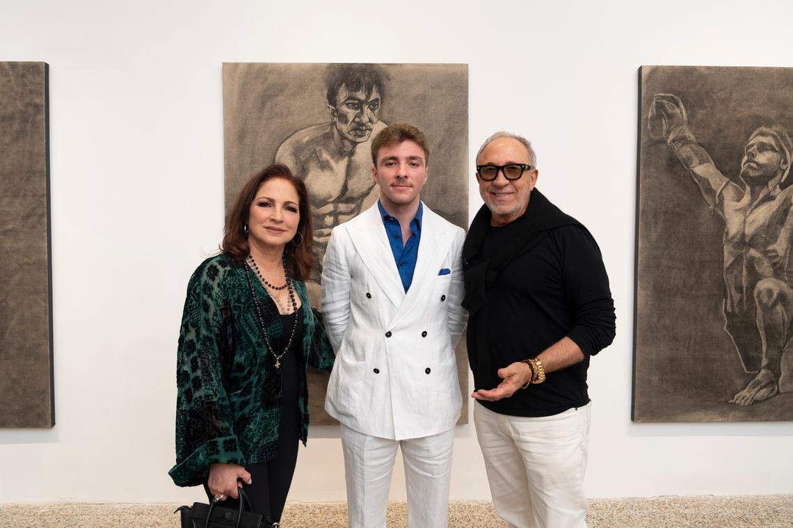 Gloria Estefan, Rocco Ritchie and Emilio Estefan at Ritchie’s Design District art show in Miami’s Design District Wednesday night.