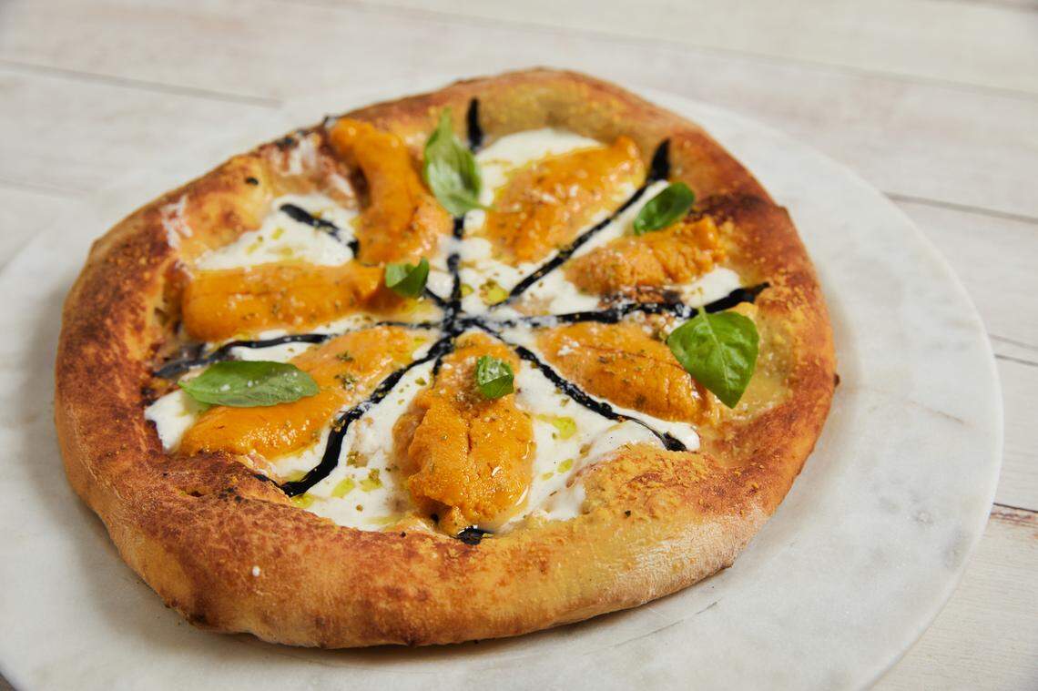 Sea urchin and Burrata pizza is now on the menu at Noma Beach at Redfish.