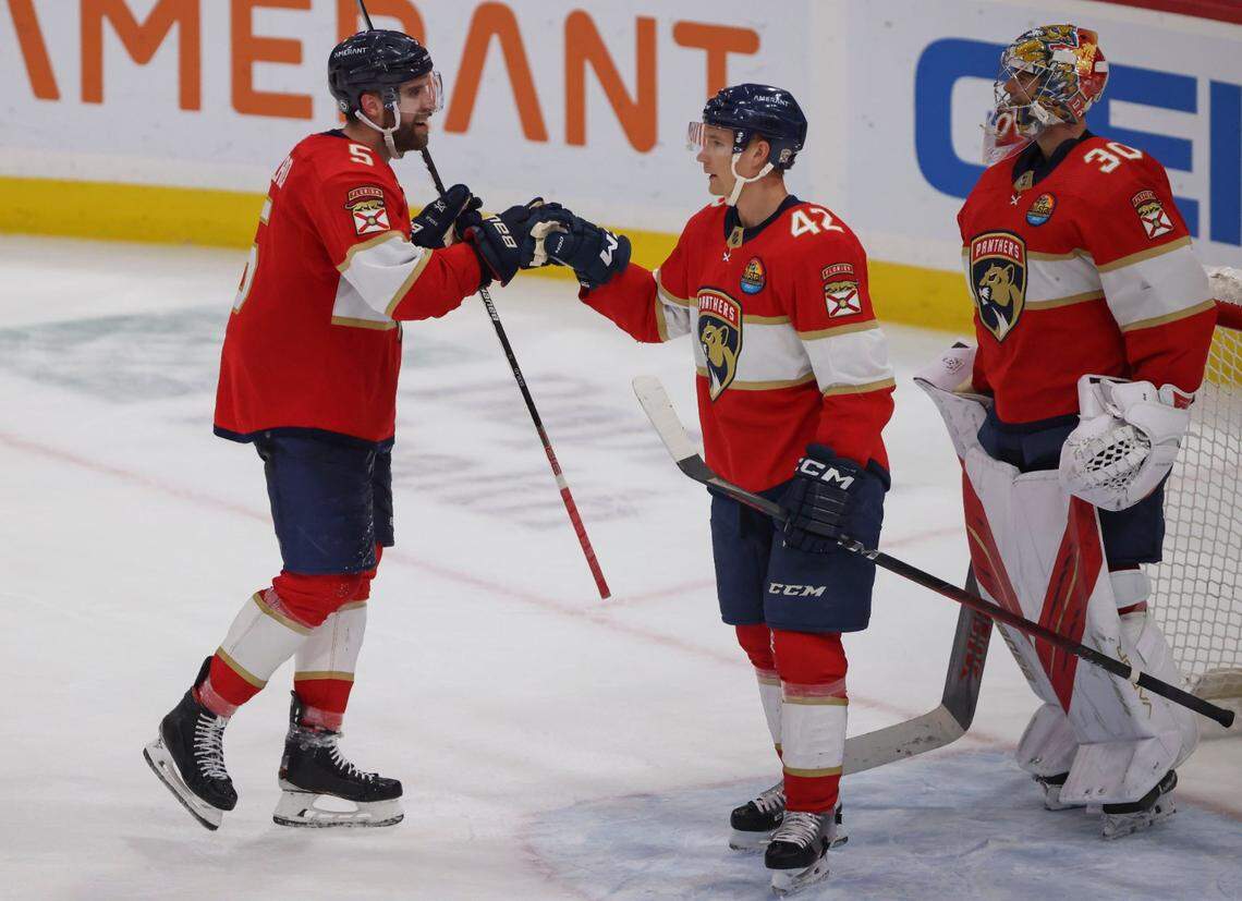 Florida Panthers defenseman Aaron Ekblad (5) bumps fists with defenseman Gustav Forsling (42) during the third period of a NHL game between the Florida Panthers and the Arizona Coyotes on Tuesday, Jan. 3, 2023, at FLA Live Arena in Sunrise, Fla. The Florida Panthers won 5-3.