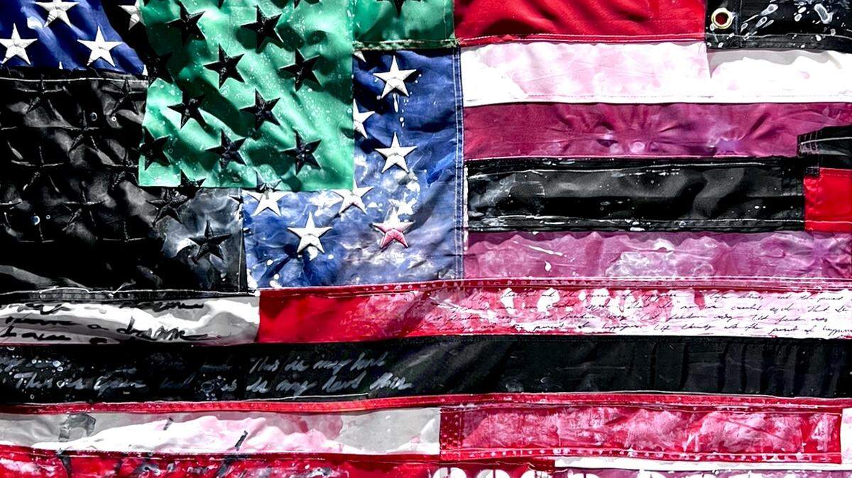 Brandon Clarke’s re-imagining of the birth of America at its core, stitching the stars and stripes to include all the groups who helped build the country, is part of the exhibition, ‘BLACK Card: Transactions of Cultural Currency’ at the Historic Ward Rooming House in Overtown.