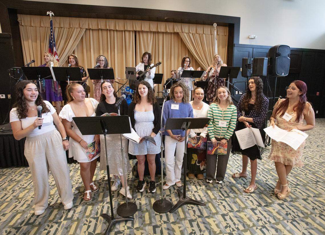 The young Jewish ladies, participating in the Third Annual South Dade Community Women's Passover Seder, sing "the four questions" traditionaly done by young members of Seder on Sunday, March 30, 2026 at Temple Judea in Coral Gables. Andrew Uloza / for Miami Herald