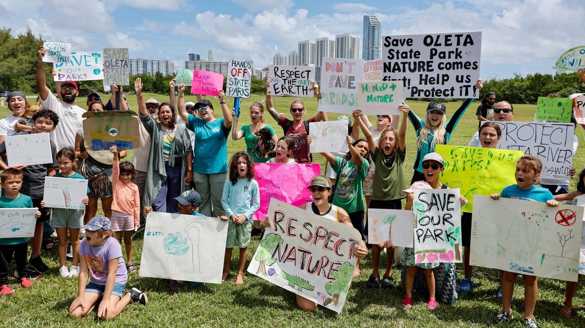 Protesters with Keep Florida State Parks Wild-Defend Oleta State Park raised their voices against the Florida Department of Environmental Protection’s plan to add pickleball courts, cabins and a disc golf course to Oleta River State Park in North Miami Beach on August 27, 2024.