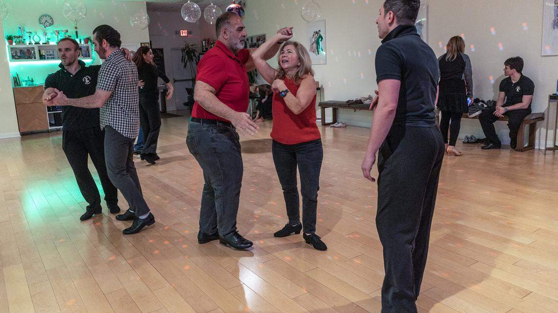 Dance instructors Stefan Ilies instructs students Maggie and Edward Fazzah as they practice during a class at Let's Dance Miami studio in Aventura, on Wednesday, February 18, 2026.