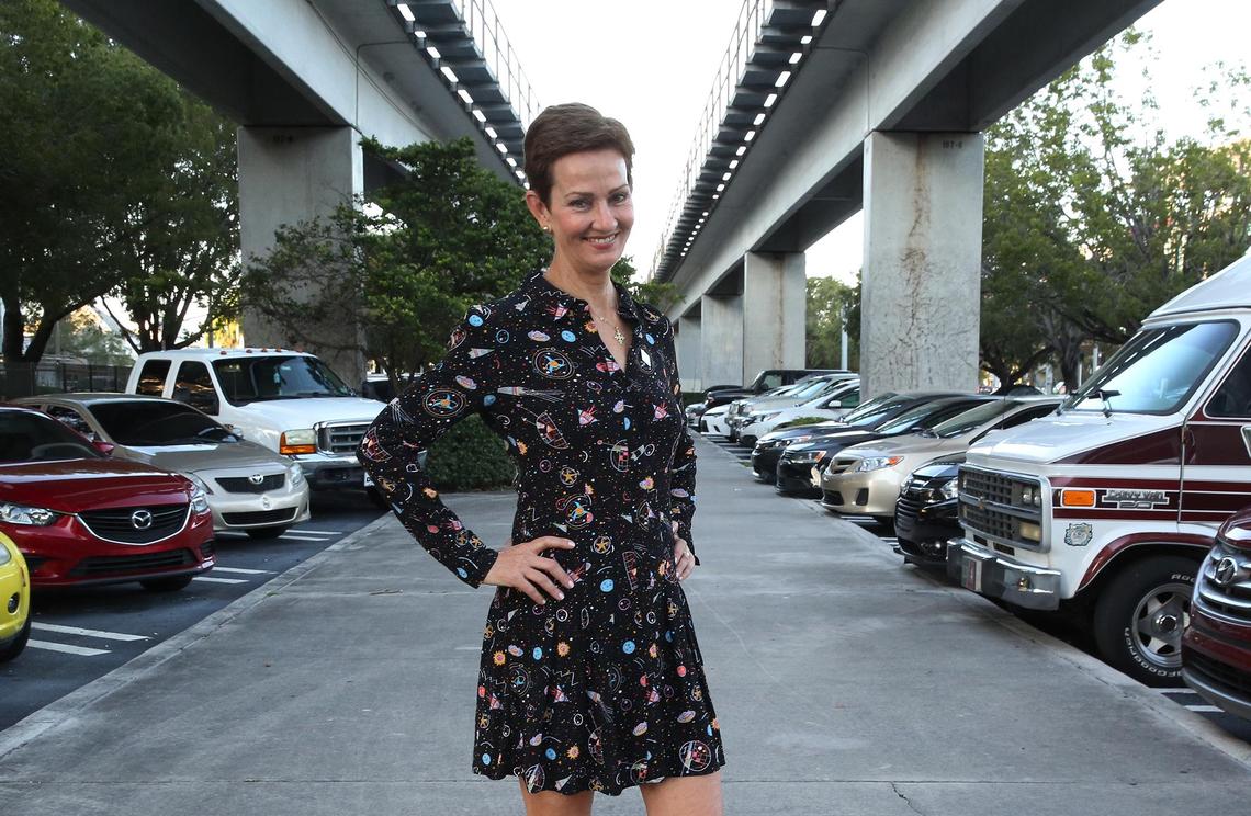 Meg Daly, founder of Friends of the Underline, stands under the elevated tracks of the University of Miami Metrorail Station.
