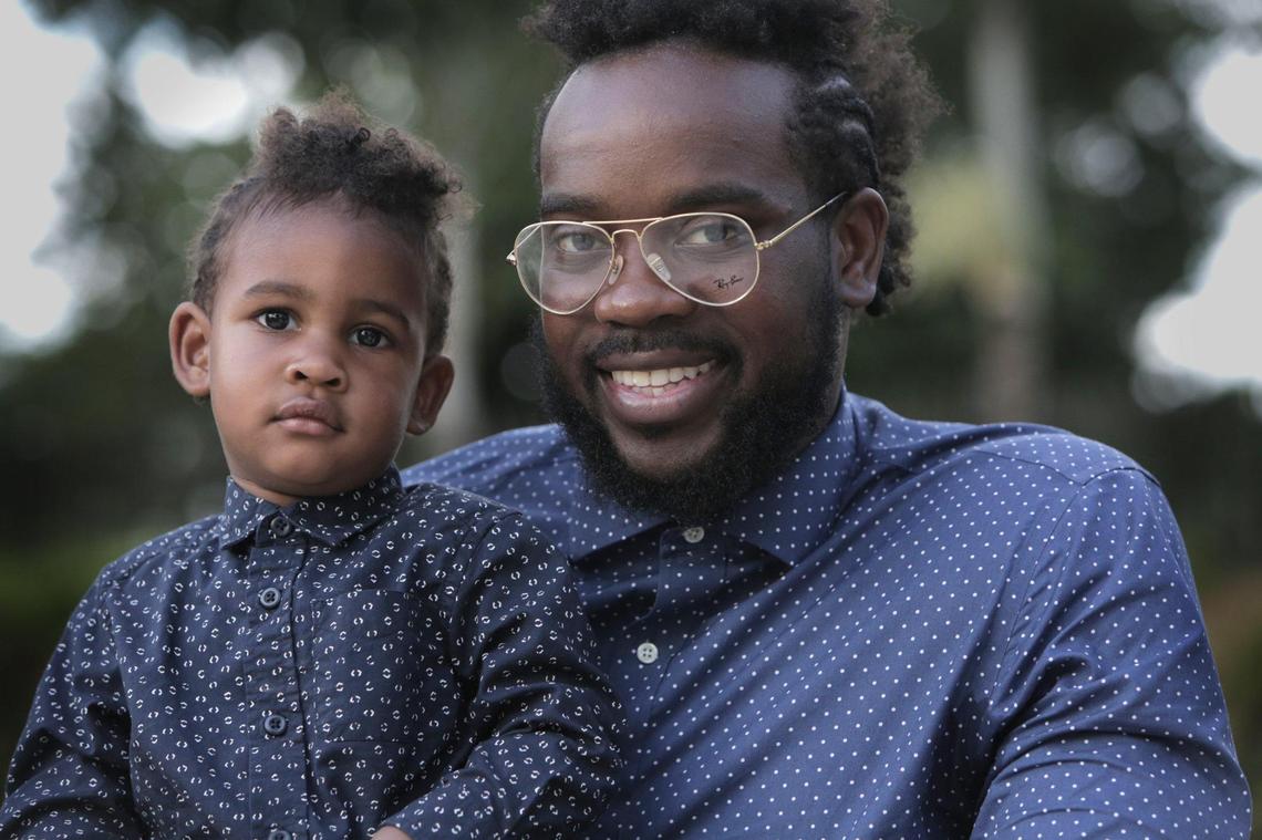 Corey Patterson with his 19-month-old son, Cole. Patterson is instilling in him how he is loved, smart and strong, reciting this in a nighttime ritual.