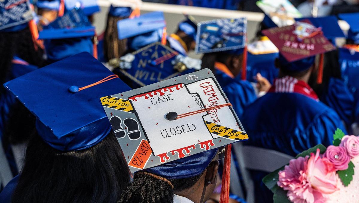 A student displays a cap decorated with blood, caution tape and other crime scene details at the spring commencement ceremony at Florida Memorial University in Miami Gardens, on Saturday May 6, 2023.