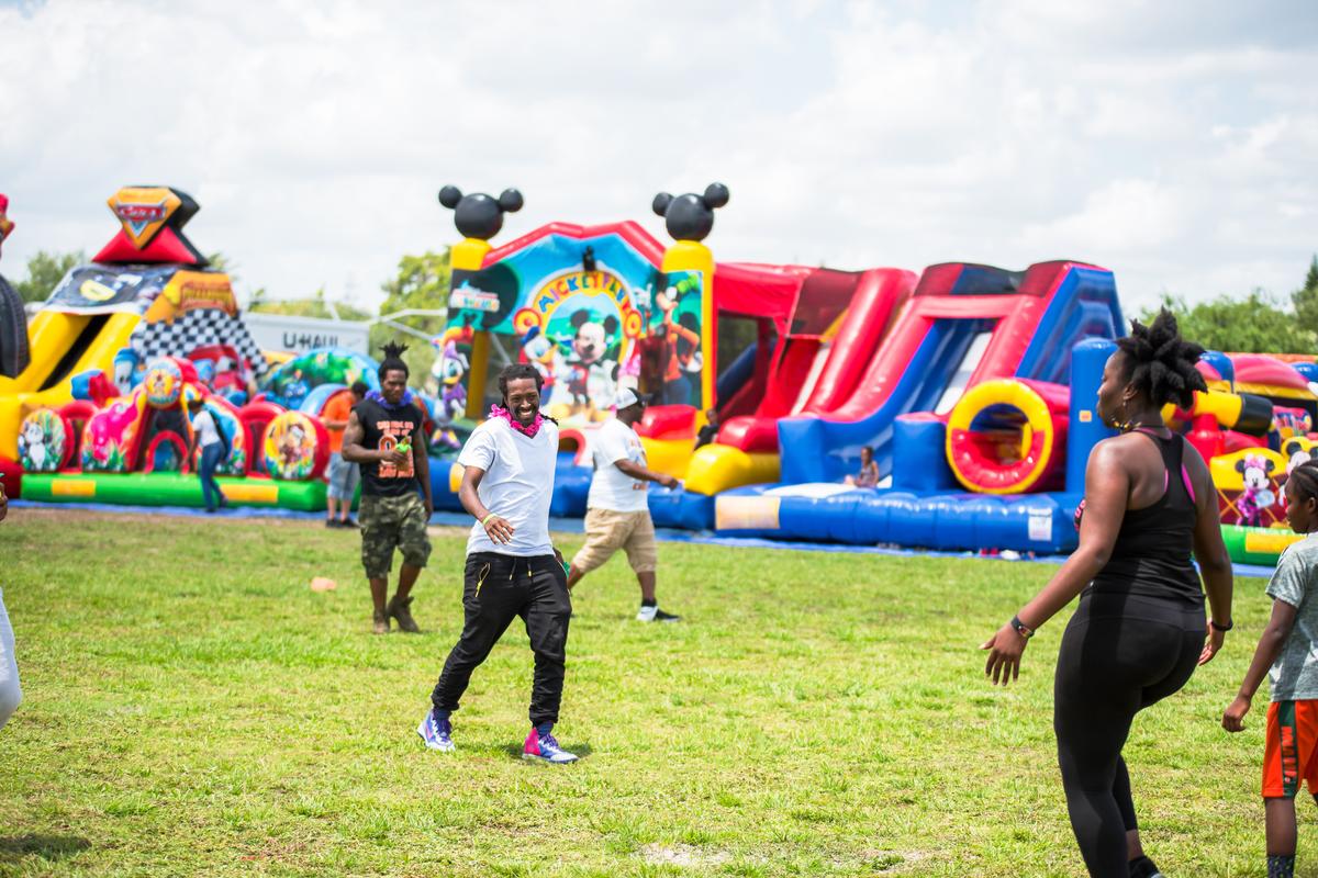 People celebrate at the Chief Hall Picnic in Miami Gardens, Florida on Saturday, April 14, 2018.Beginning in 2016, the Chief Hall Picnic has allowed for Miami Carol City Senior High School alumni to come together and fellowship.