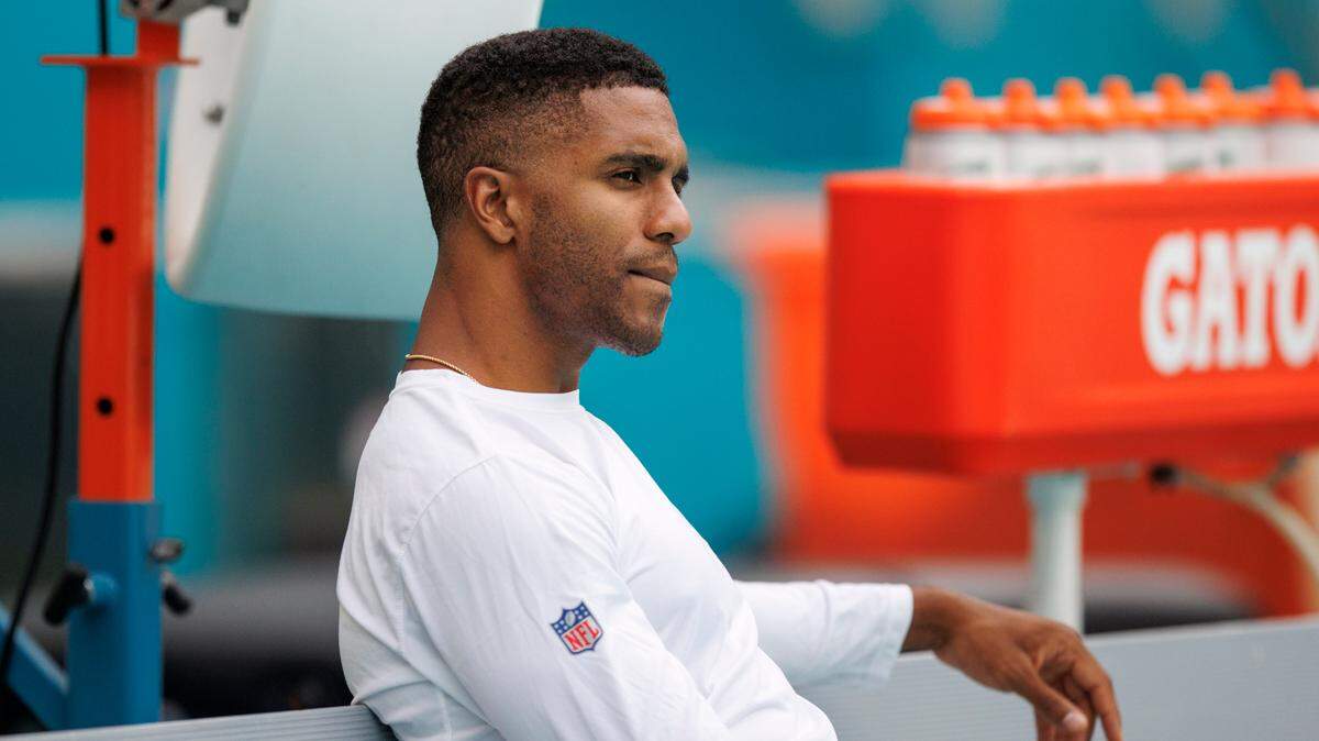 Miami Dolphins cornerback Byron Jones (24) looks from the bench before the start of a NFL preseason football game against the Las Vegas Raiders at Hard Rock Stadium on Saturday, August 20, 2022 in Miami Gardens, Florida.