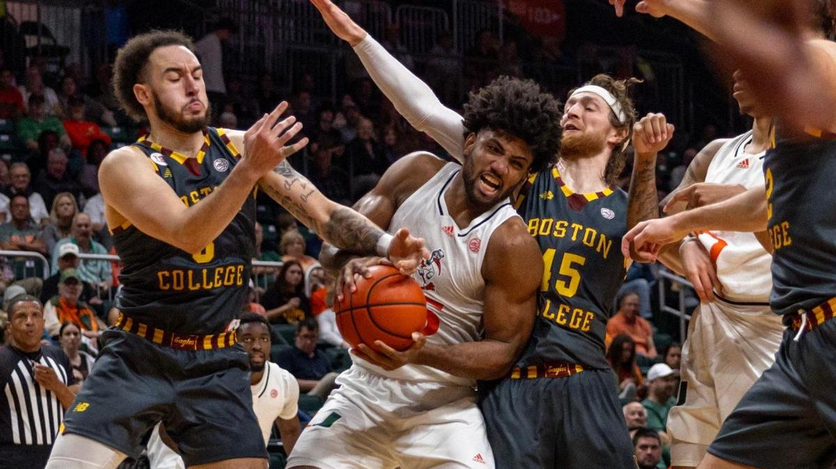Hurricanes forward Norchad Omier (15) fights for possession of the ball with Boston College Eagles guard Jaeden Zackery (3) during the second half of an NCAA basketball game against at Watsco Center in Coral Gables, Florida on Wednesday, March 6, 2024.