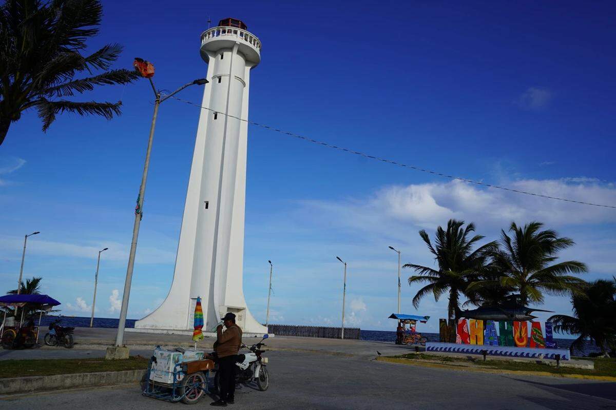 This lighthouse marks the shoreline of Mahahual, a coastal town whose identity is rooted in the sea and increasingly shaped by debates over development and environmental protection.