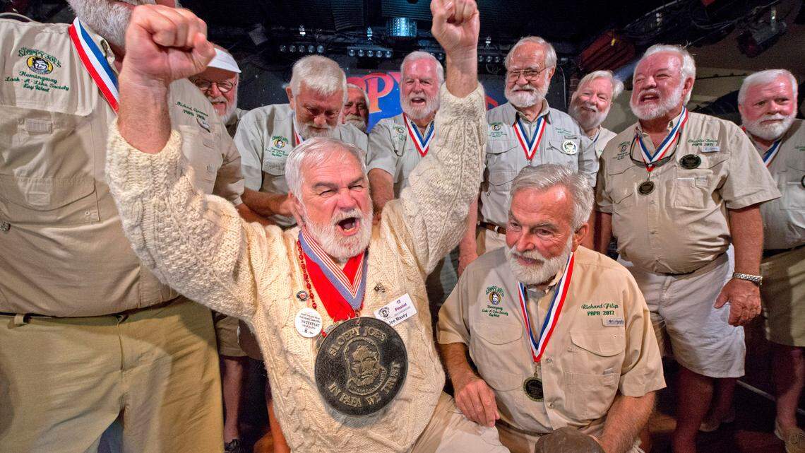 Joe Maxey, second from left, celebrates his victory at the Hemingway Look-Alike Contest at Saturday, July 20, 2019, at Sloppy Joe’s Bar in Key West, Fla. After taking a year off due to the COVID-19 pandemic, organizers of the look-alike contest announced Friday, May 7, 2021, that the 2021 contest, the 40th edition, is planned for July 22-24.
