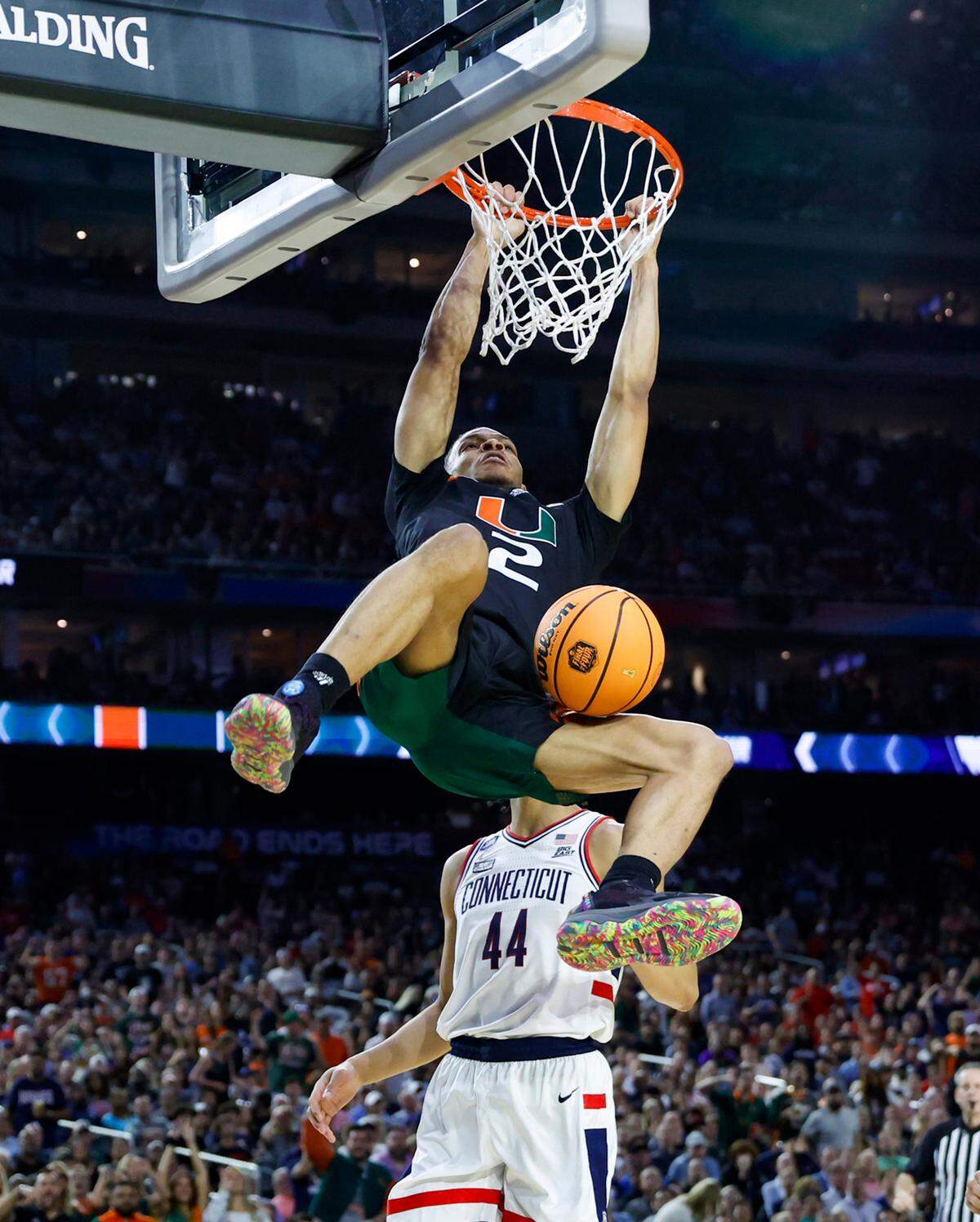 Miami Hurricanes guard Isaiah Wong (2) dunks against Connecticut Huskies guard Andre Jackson Jr. (44) during the second half of the Men’s Basketball Championship National Semifinal at NRG Stadium in Houston, Texas on Saturday, April 1, 2023.