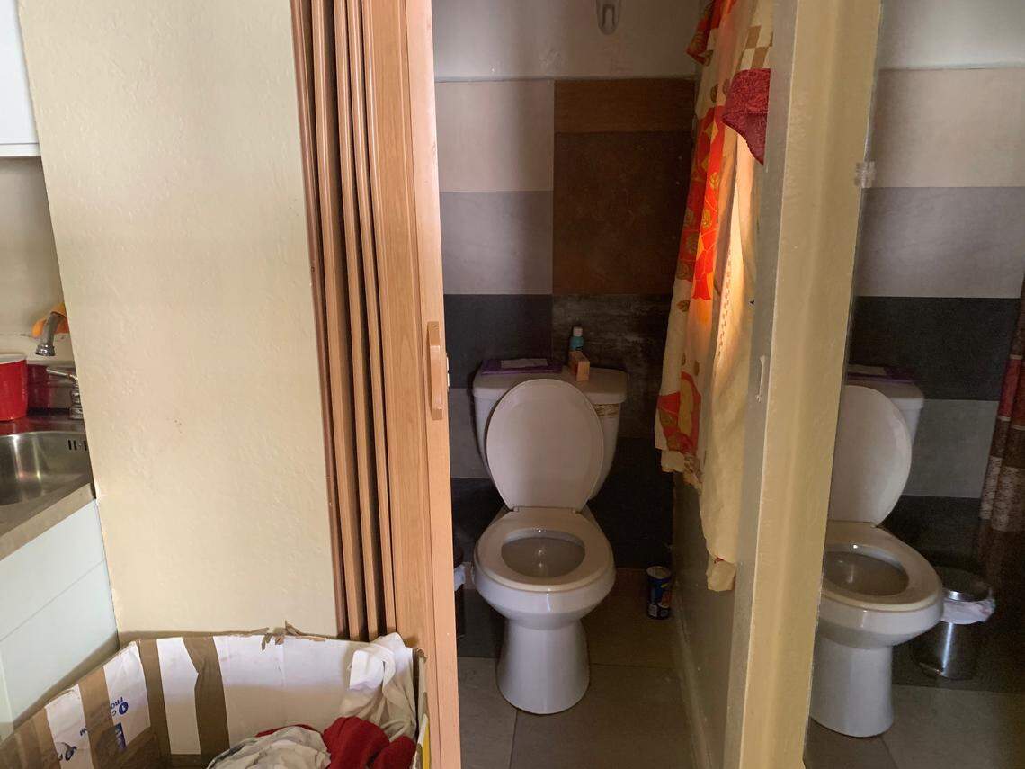 Miami Code Enforcement reported unpermitted work at a Flagami home that is owned by Tania Hernandez and where boarders rented rooms, including this one with a toilet shoehorned into a closet.