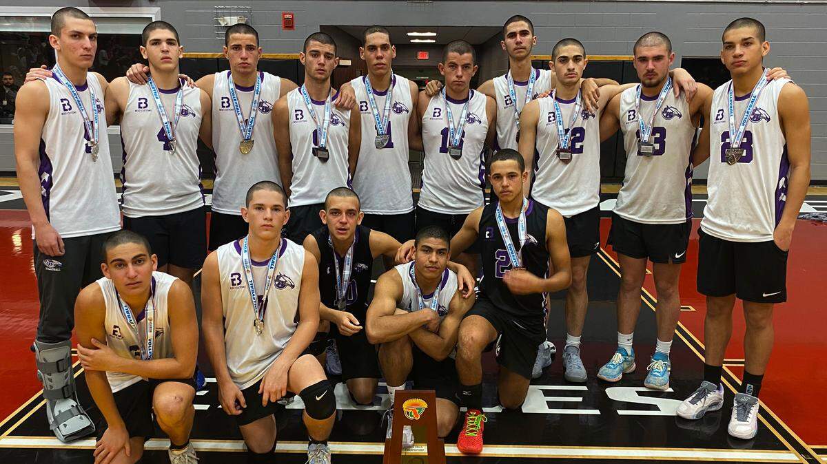 Miami Southwest players stand with the boys volleyball state runner-up trophy at the FHSAA Finals on Saturday at Polk State College.