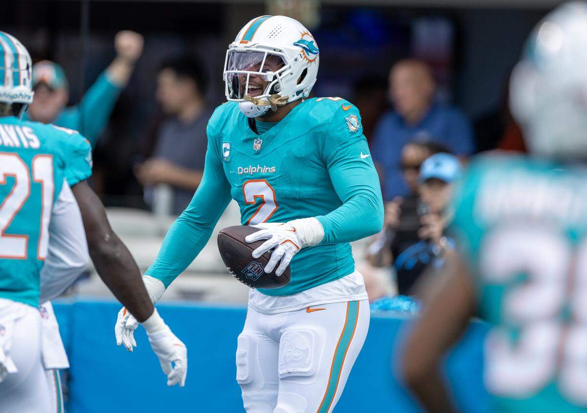 Miami Dolphins outside linebacker Bradley Chubb (2) celebrates after forcing and recovering a fumble by Carolina Panthers quarterback Bryce Young (9) during the first half of an NFL game at Bank of America Stadium on Sunday, Oct. 5, 2025, in Charlotte, N.C.