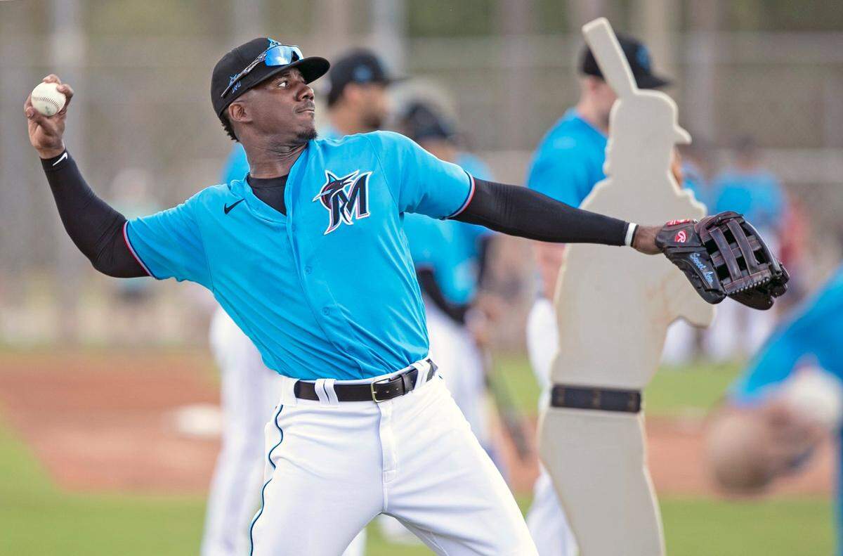 Miami Marlins outfielder Lewis Brinson (25) throws during spring training at the Roger Dean Chevrolet Stadium in Jupiter on Wednesday, February 19, 2020.