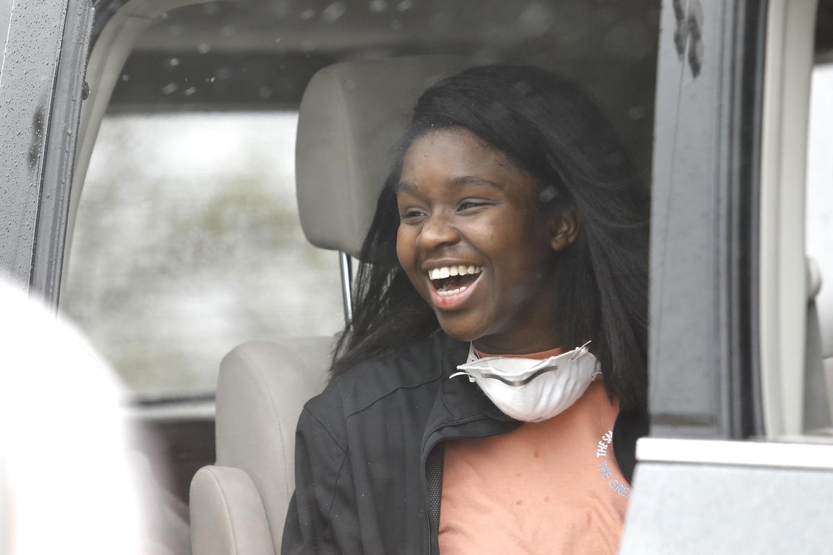Julia Whitcomb of Poplar Grove is welcomed back home during a vehicle parade of well wishers Sunday, May 10, 2020, at the former Shopko parking lot in Belvidere.