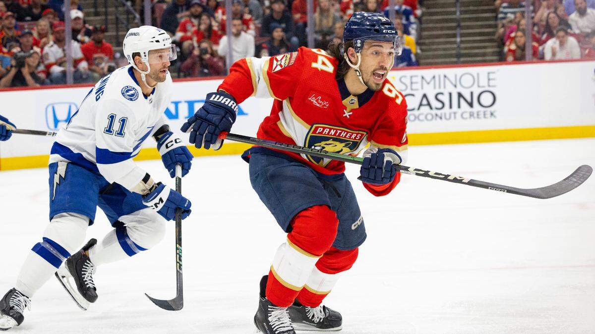 Florida Panthers left wing Ryan Lomberg (94) skates around Tampa Bay Lightning center Luke Glendening (11) for the puck during the second period of Game 1 of the Stanley Cup Playoffs Round 1 on Sunday, April 21, 2024, at Amerant Bank Arena in Sunrise, Fla. The score was 1-1 at the end of the second period.