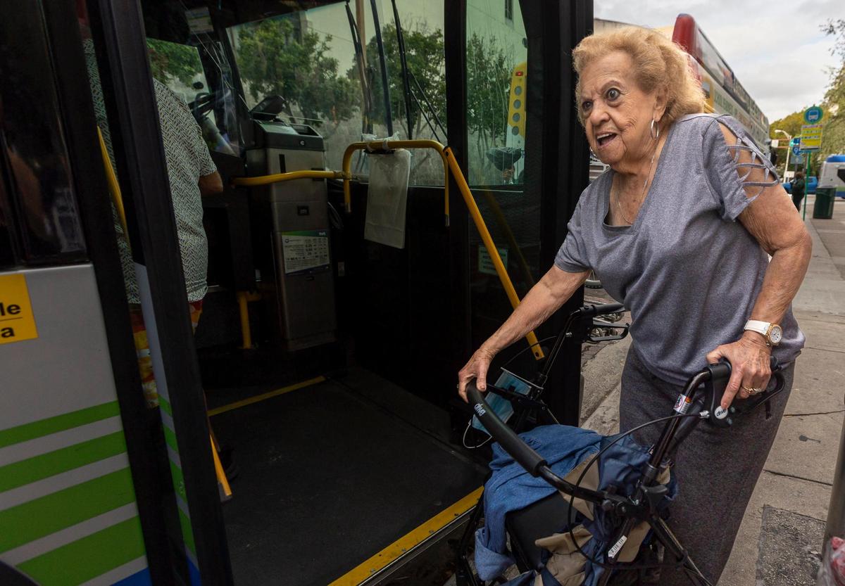 Maria Torres boards her bus at the Stephen P. Clark Center in downtown Miami on the first day of the rollout of the Better Bus Network, November 13, 2023.