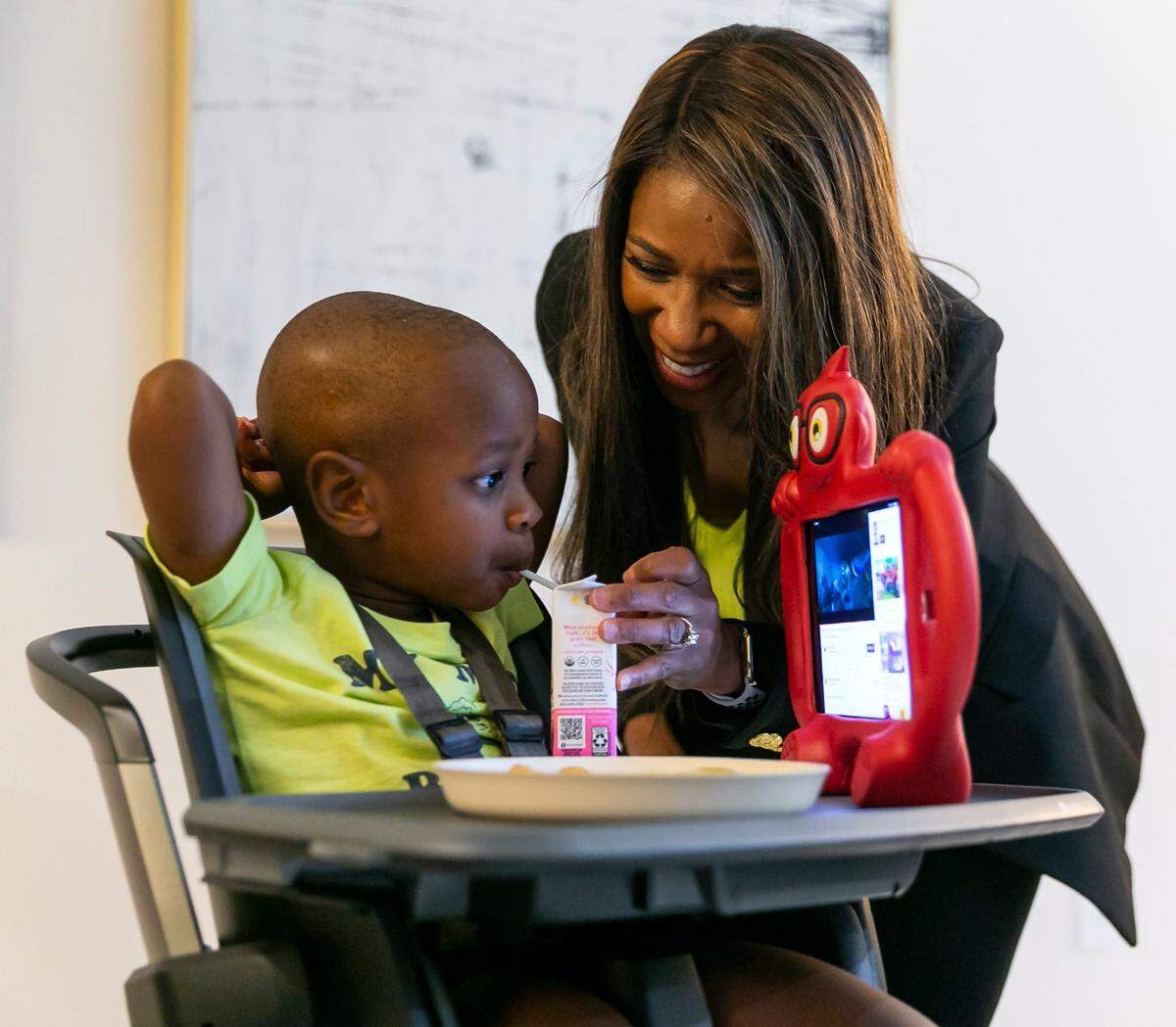 Symeria Hudson, the president and CEO of Chapman Partnership, feeds her son, Garrett, at their home in Fort Lauderdale. He turned 3 on Nov. 2.