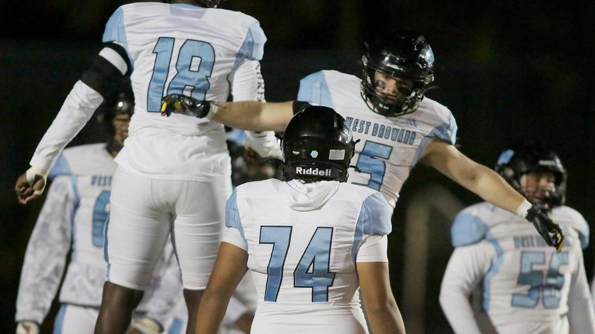West Broward Bobcats celebrate a touchdown by running back Elijah Dewoskin (5) during a Region 4-6A semifinal football game against the Piper Bengals on Friday, November 22, 2024 at Piper HS in Sunrise.