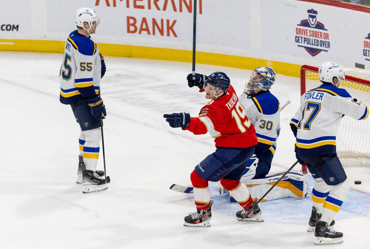 Florida Panthers left wing Matthew Tkachuk (19) celebrates after center Aleksander Barkov (16) scores the game-winning goal in overtime against the St. Louis Blues at Amerant Bank Arena on Friday, Dec. 20, 2024, in Sunrise, Fla.