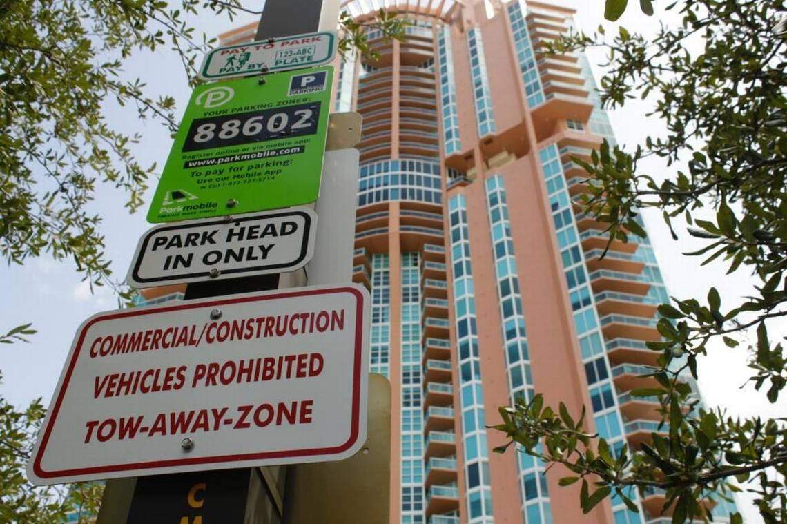 A ParkMobile sign and kiosk in Miami Beach in a 2018 file photo.