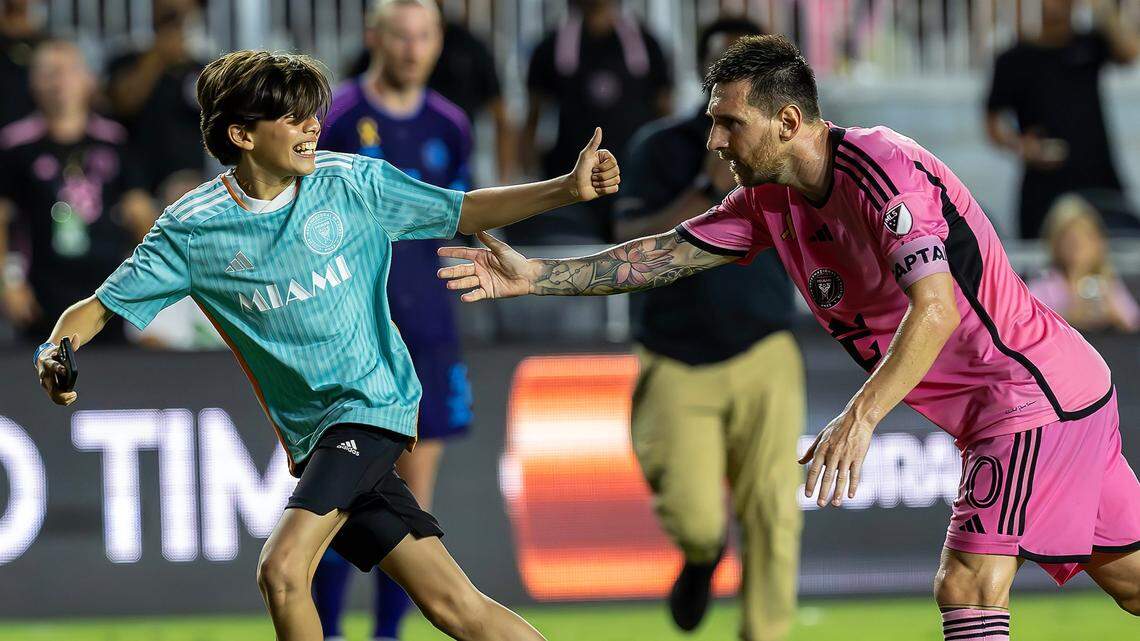 A field invader attempts to take a photo with Inter Miami forward Lionel Messi (10) in the first half of his MLS match against Charlotte FC at Chase Stadium on Saturday, Sept. 28, 2024, in Fort Lauderdale, Fla.