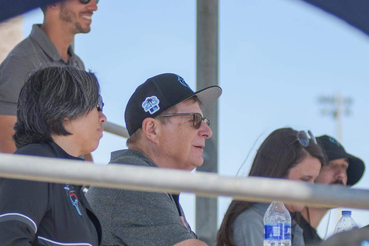 Miami Marlins general manager Kim Ng (left) and principal owner Bruce Sherman watch pitcher prospect Eury Perez throw a live batting practice session on Monday, Feb. 20, 2023, at the Roger Dean Chevrolet Stadium complex in Jupiter, Florida.