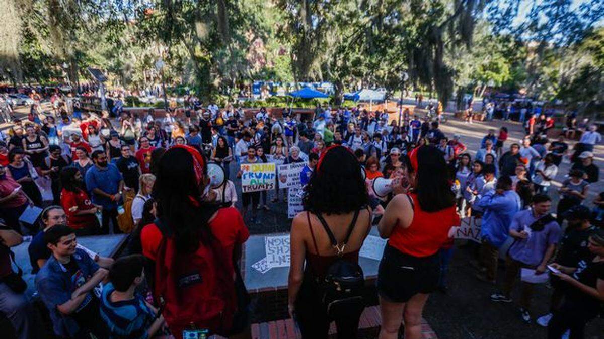 Protesters gathered at the University of Florida’s Turlington Plaza to practice anti-Trump chants before an Oct. 10 appearance by Donald Trump Jr. and Kimberly Guilfoyle. Controversy over the appearance continues to reverberate, with calls to impeach the student body president.