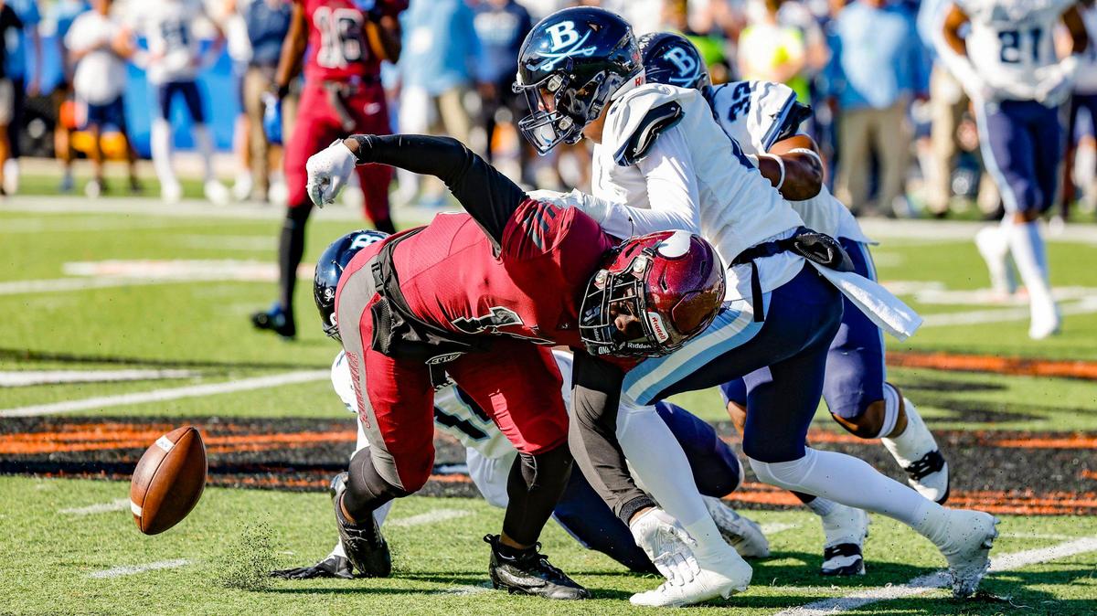 Miami Norland Vikings (14) wide receiver Jade Card fumbles the ball caused by Berkeley Prep’s Juelz Aurelien (14) and Owen Watts (81) making the tackle in the first half of the Class 2M state championship game at Bragg Memorial Stadium in Tallahassee, Florida, on Saturday, December 9, 2023.