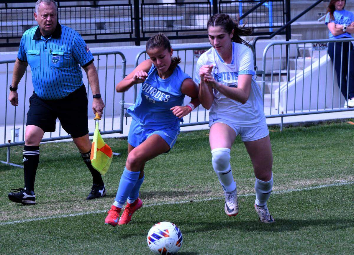 Lourdes Academy sophomore forward Veronica Aguilar (13) battles for possession of the ball with a Ponte Vedra defender during the Class 5A girls soccer state championship game on Saturday at Lake Myrtle Sports Complex. 