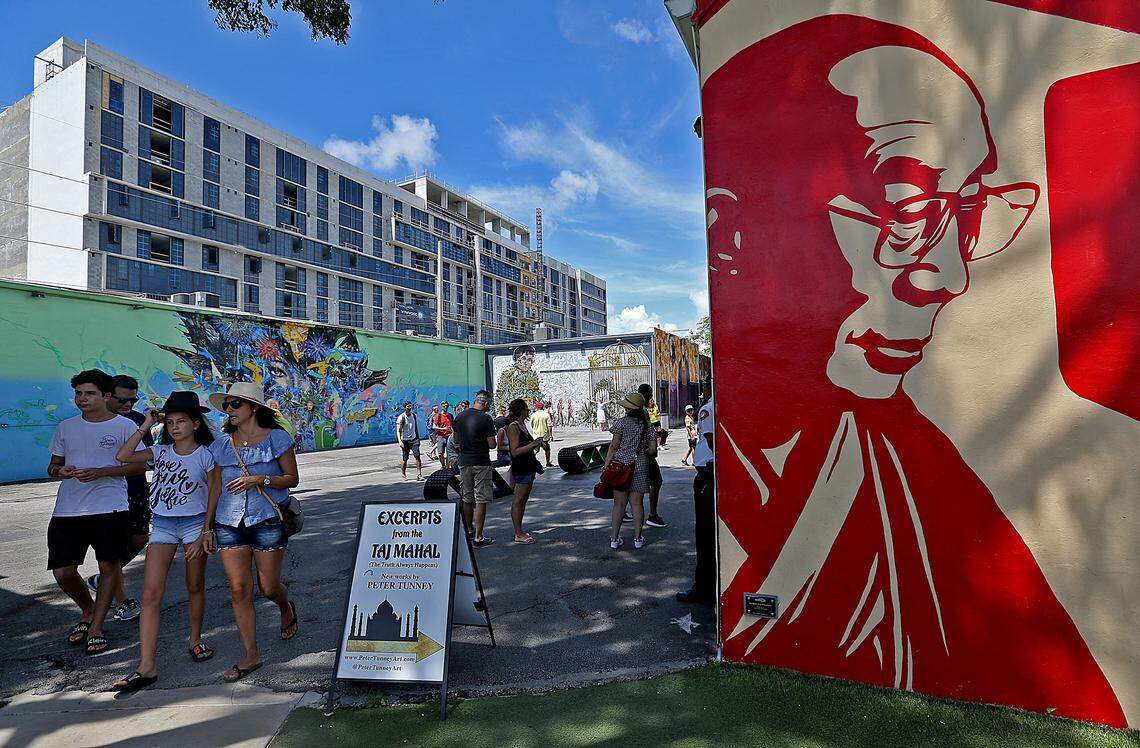 Visitors get pictures of the colorful murals at the Wynwood Walls.