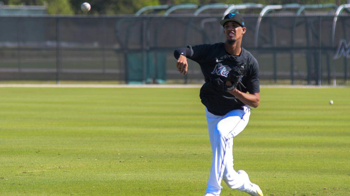 Miami Marlins right-handed pitcher Eury Perez plays catch during a workout at the Roger Dean Chevrolet Stadium complex in Jupiter, Florida, on Wednesday, Feb. 15, 2022.